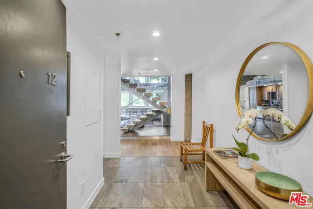 a view of a living room and kitchen