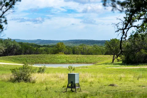 a view of a lake with a big yard
