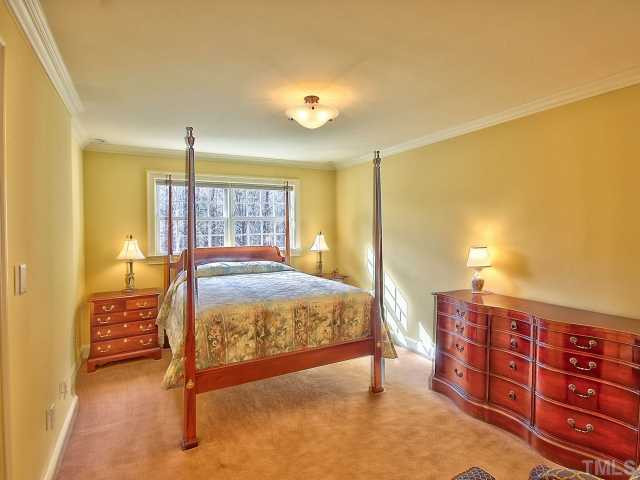 14412 Possum Track Road Raleigh, NC 27614 - Photo 15 of 25 Bedroom 2 with custom trim. Also has great view of yard. Bedroom