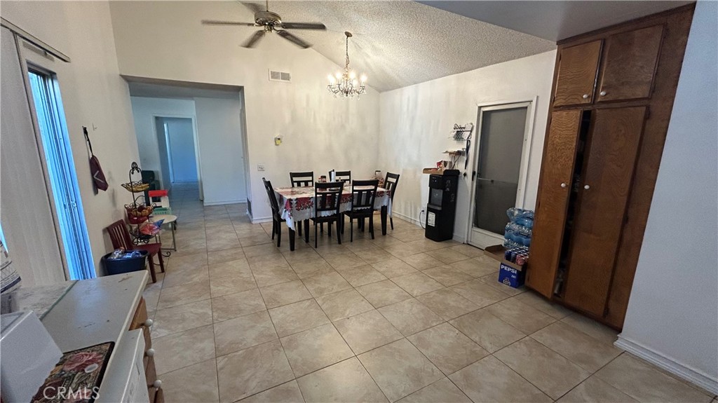 13254 Powers Court Poway, CA 92064 - Photo 6 of 11 a view of a dining room with furniture and a chandelier