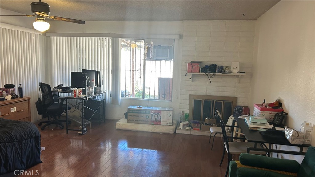 13254 Powers Court Poway, CA 92064 - Photo 7 of 11 a living room with furniture a fireplace and a flat screen tv
