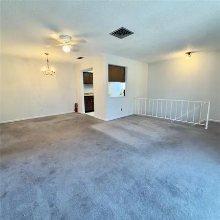 a view of an empty room with a bathroom