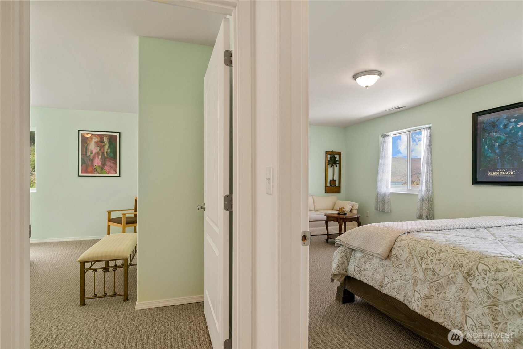 165 Granite Falls Road Chelan, WA 98816 - Photo 14 of 27 a bedroom with a bed and wooden floor