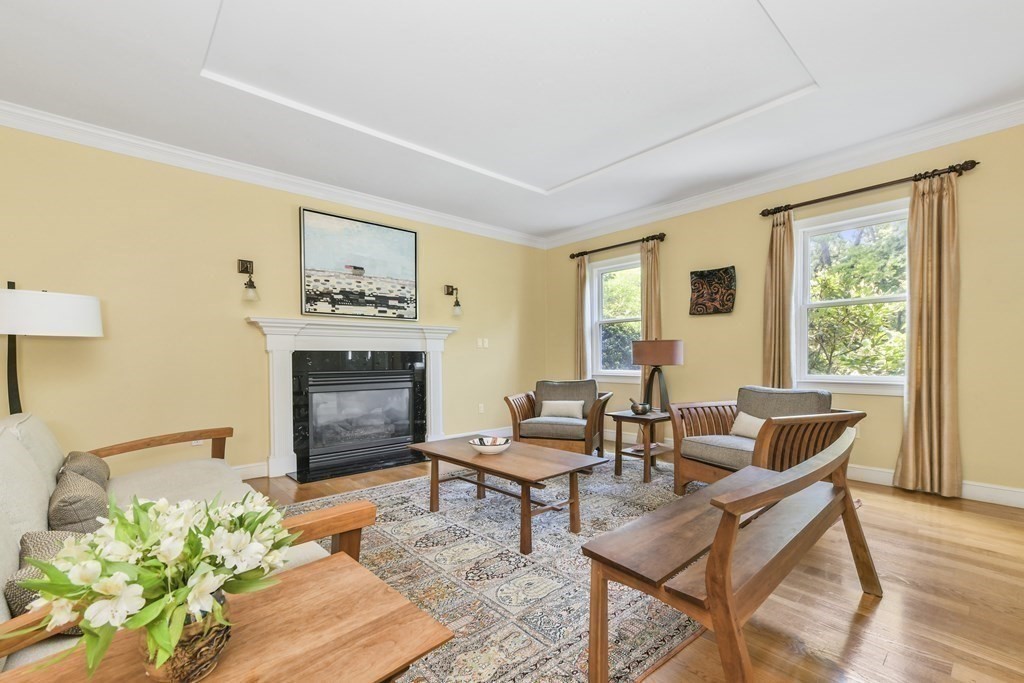 39 Brooks Road Lincoln, MA 01773 - Photo 13 of 40 a living room with furniture and a fireplace