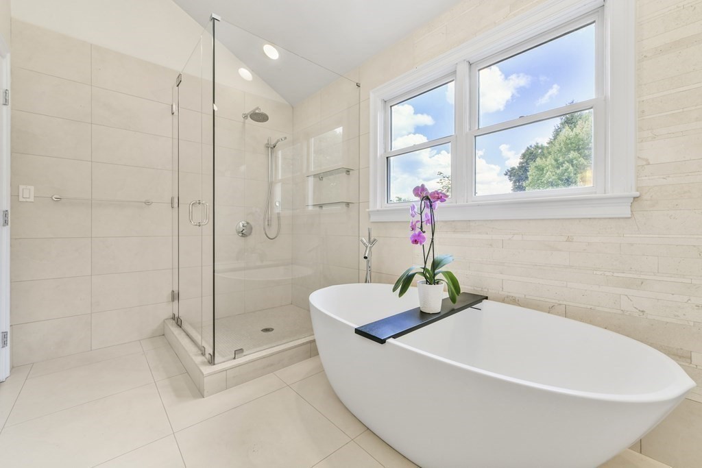 39 Brooks Road Lincoln, MA 01773 - Photo 19 of 40 a white bath tub sitting next to a shower