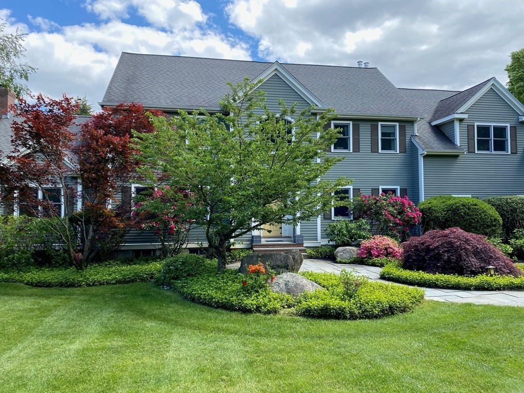 39 Brooks Road Lincoln, MA 01773 - Photo 2 of 40 a front view of a house with a garden
