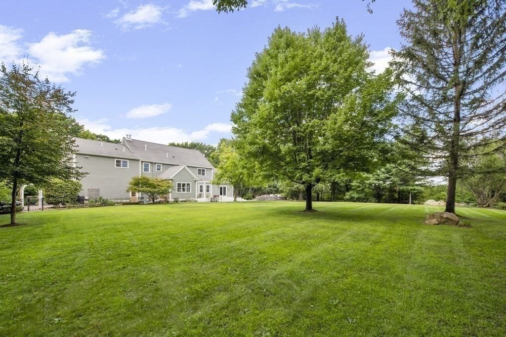 39 Brooks Road Lincoln, MA 01773 - Photo 31 of 40 a big yard with large trees and a big yard