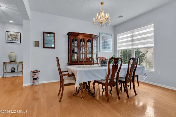 a kitchen with stainless steel appliances granite countertop a stove top oven a refrigerator and a sink