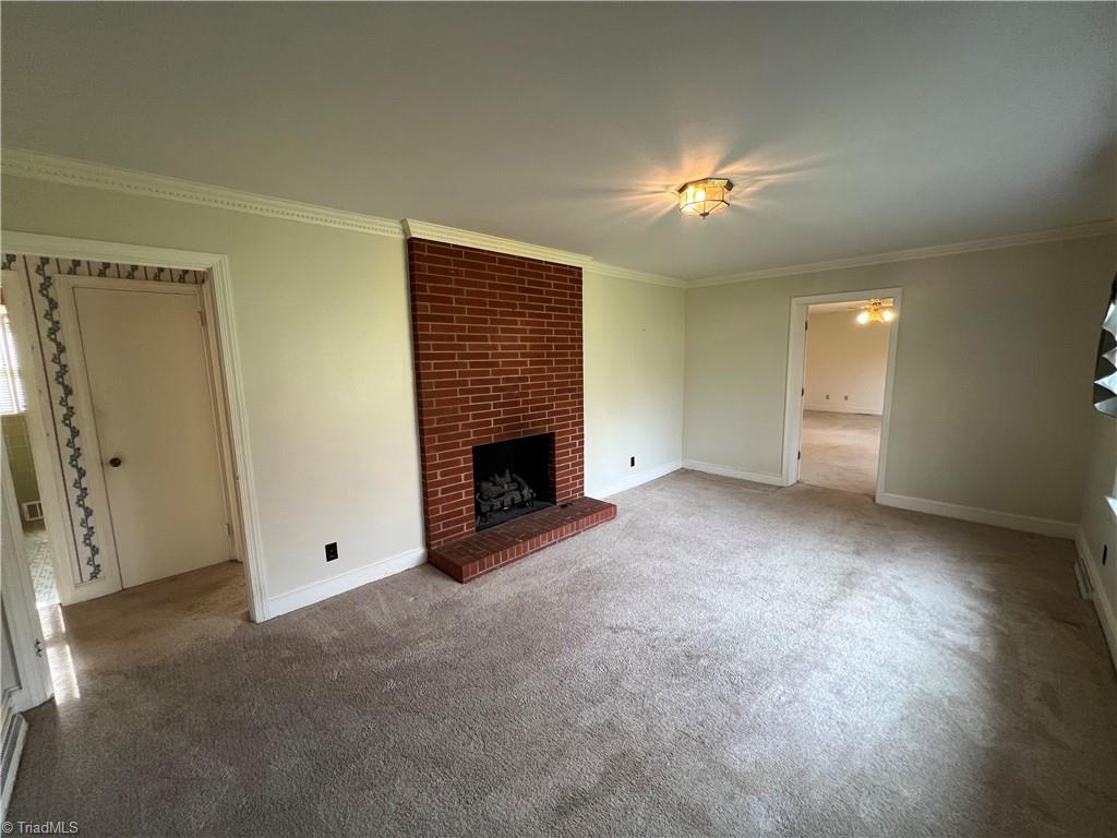 2183 Rowe Road Lexington, NC 27295 - Photo 22 of 42 Living room with gas log fireplace.