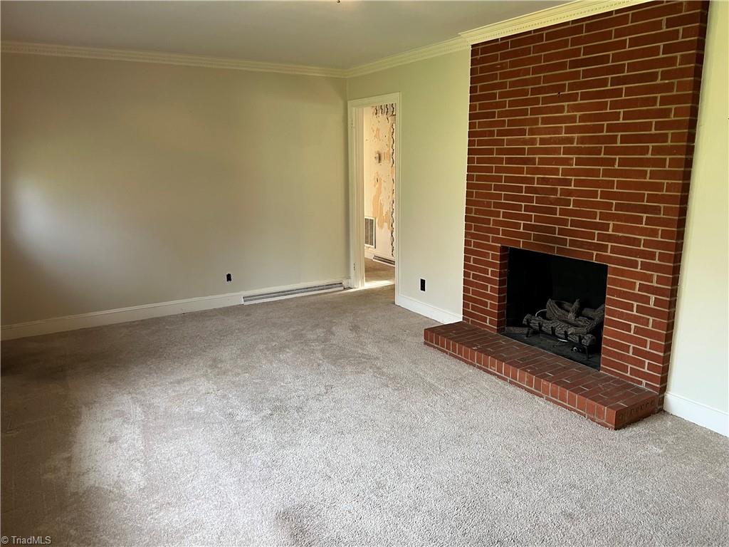 2183 Rowe Road Lexington, NC 27295 - Photo 23 of 42 Full brick mantle with this gas log fireplace.