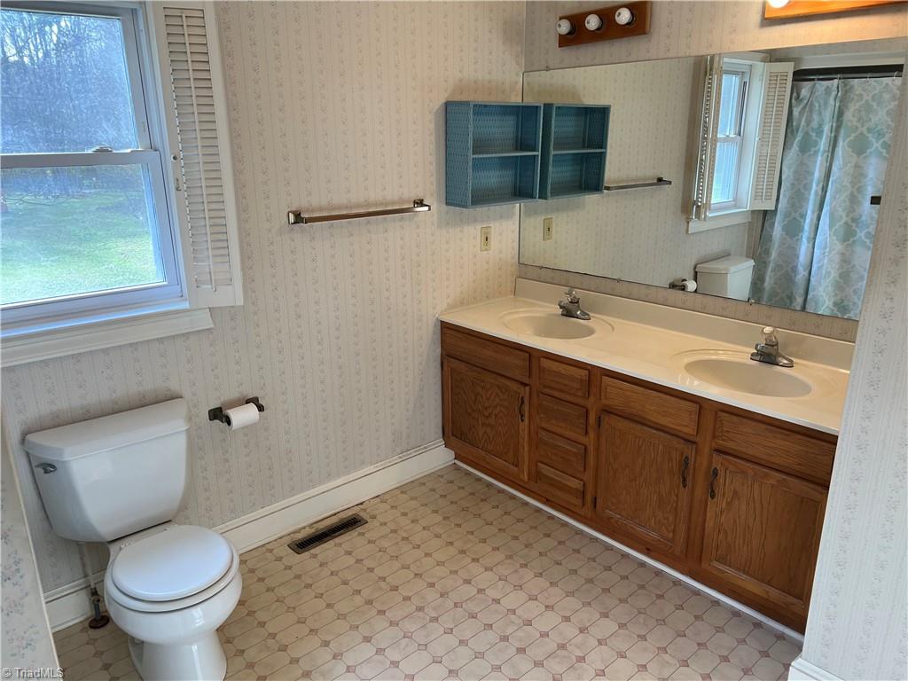 2183 Rowe Road Lexington, NC 27295 - Photo 32 of 42 Spacious primary bathroom with dual vanities.