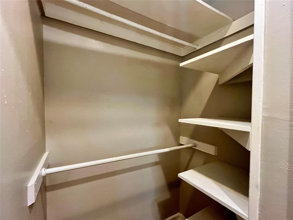 1002 Gregg Street, Unit CB Denton, TX 76201 - Photo 8 of 11 Nice closet with places to hold hanging clothes and folded clothing.