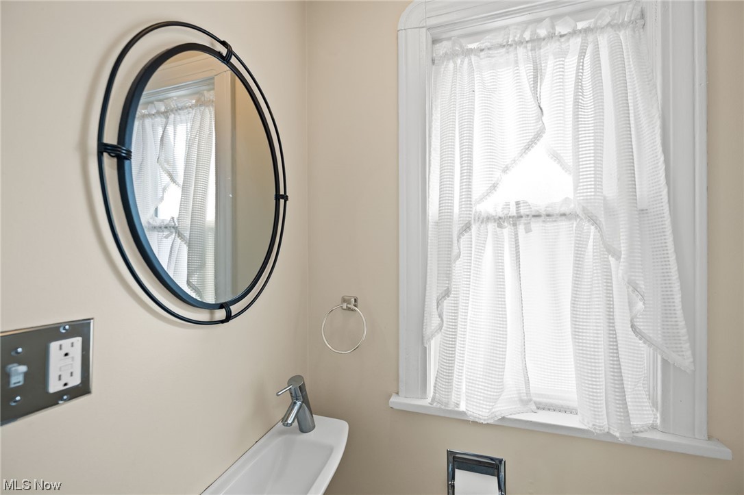 1203 Plainfield Road Cleveland, OH 44121 - Photo 14 of 35 Half bath off the kitchen