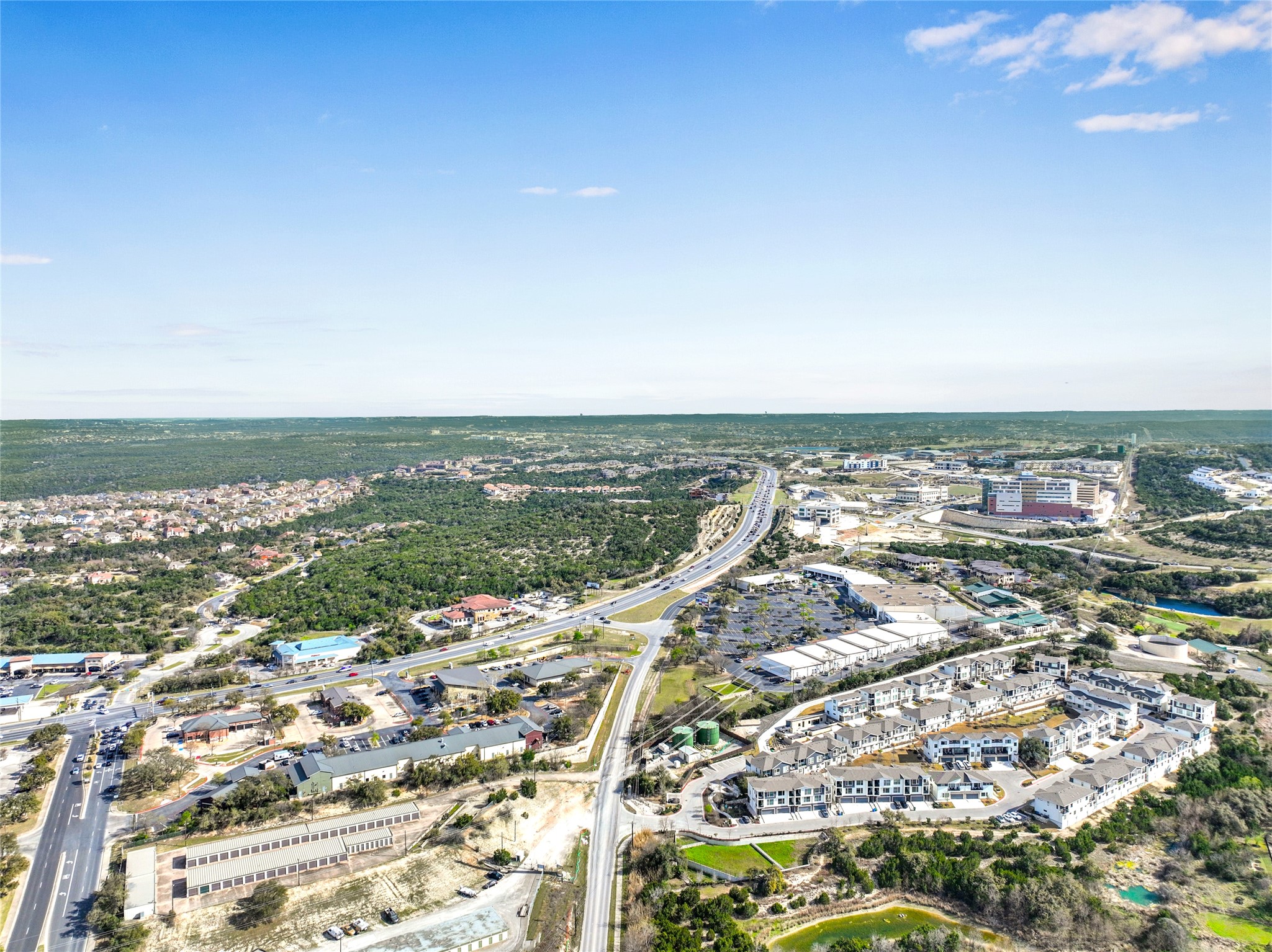 2050 Lohmans Spur Road, Unit 501 Lakeway, TX 78738 - Photo 35 of 40 an aerial view of ocean and residential houses with outdoor space