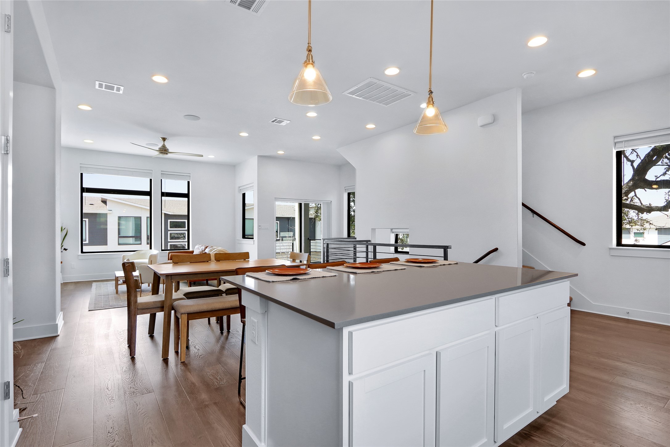 2050 Lohmans Spur Road, Unit 501 Lakeway, TX 78738 - Photo 6 of 40 a kitchen with center island table and chairs