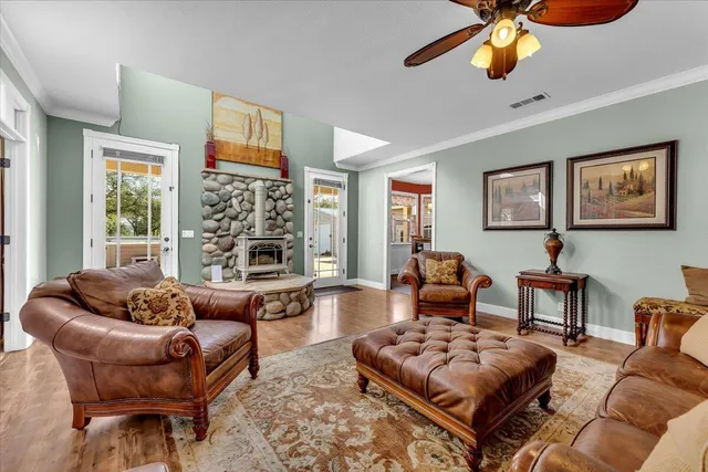 a kitchen with stainless steel appliances granite countertop a stove a sink and a refrigerator