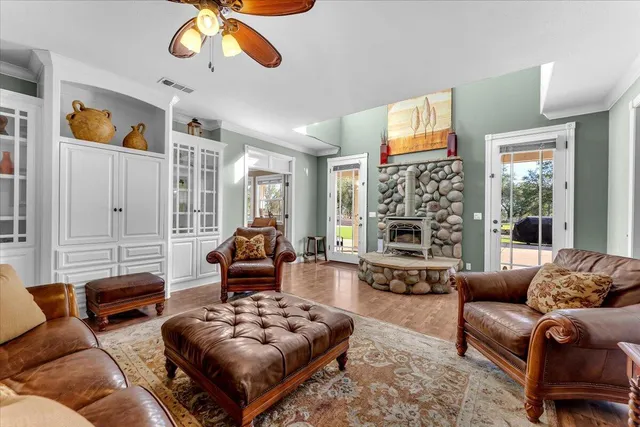 a kitchen with stainless steel appliances granite countertop a refrigerator a oven and a sink