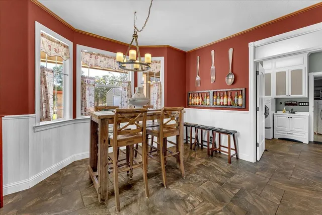 a utility room with sink dryer and washer