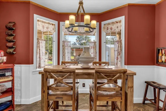 a bathroom with a toilet a sink and a mirror