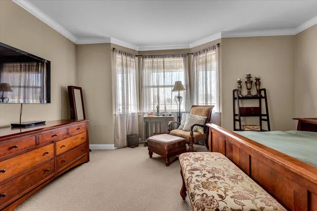 a view of a hallway with a window and a livingroom