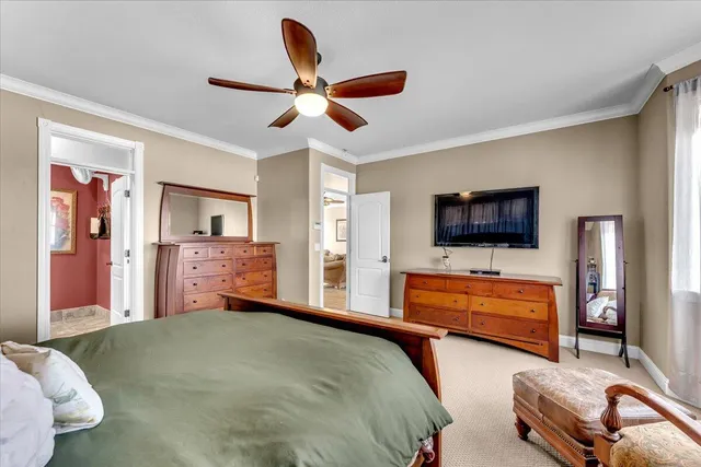 a bedroom with furniture and a chandelier