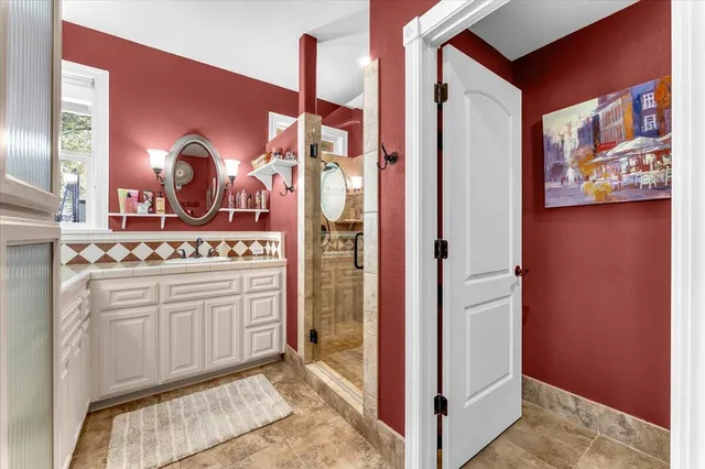 a bathroom with a sink and a mirror