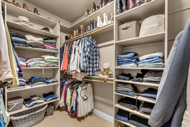 a view of a chairs and tables in the back yard of the house