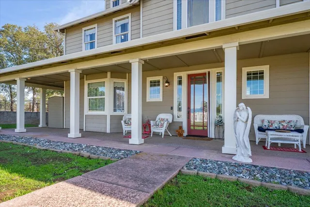 a view of an entryway with wooden floor and windows