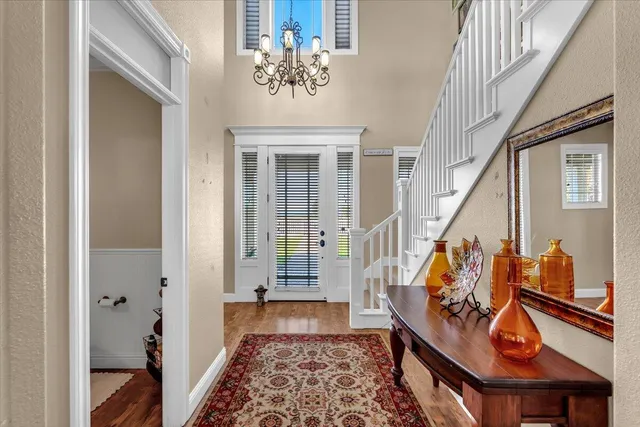 a living room with furniture window and a chandelier