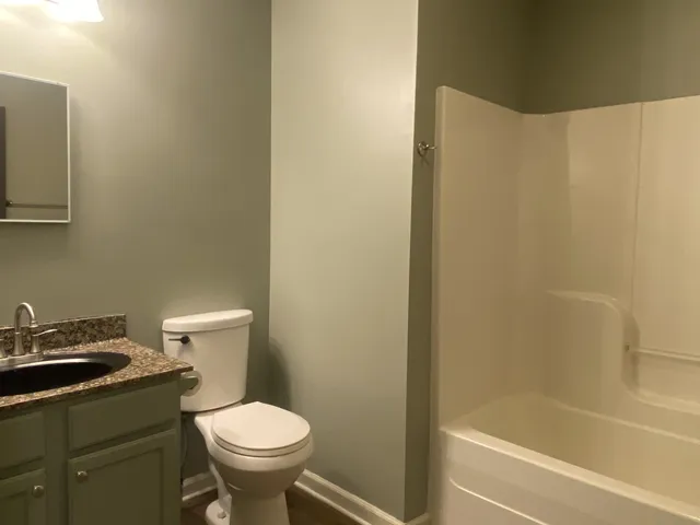 a kitchen with a sink cabinets and window