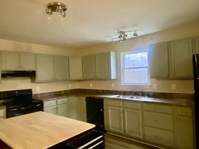 a view of a field with an ocean