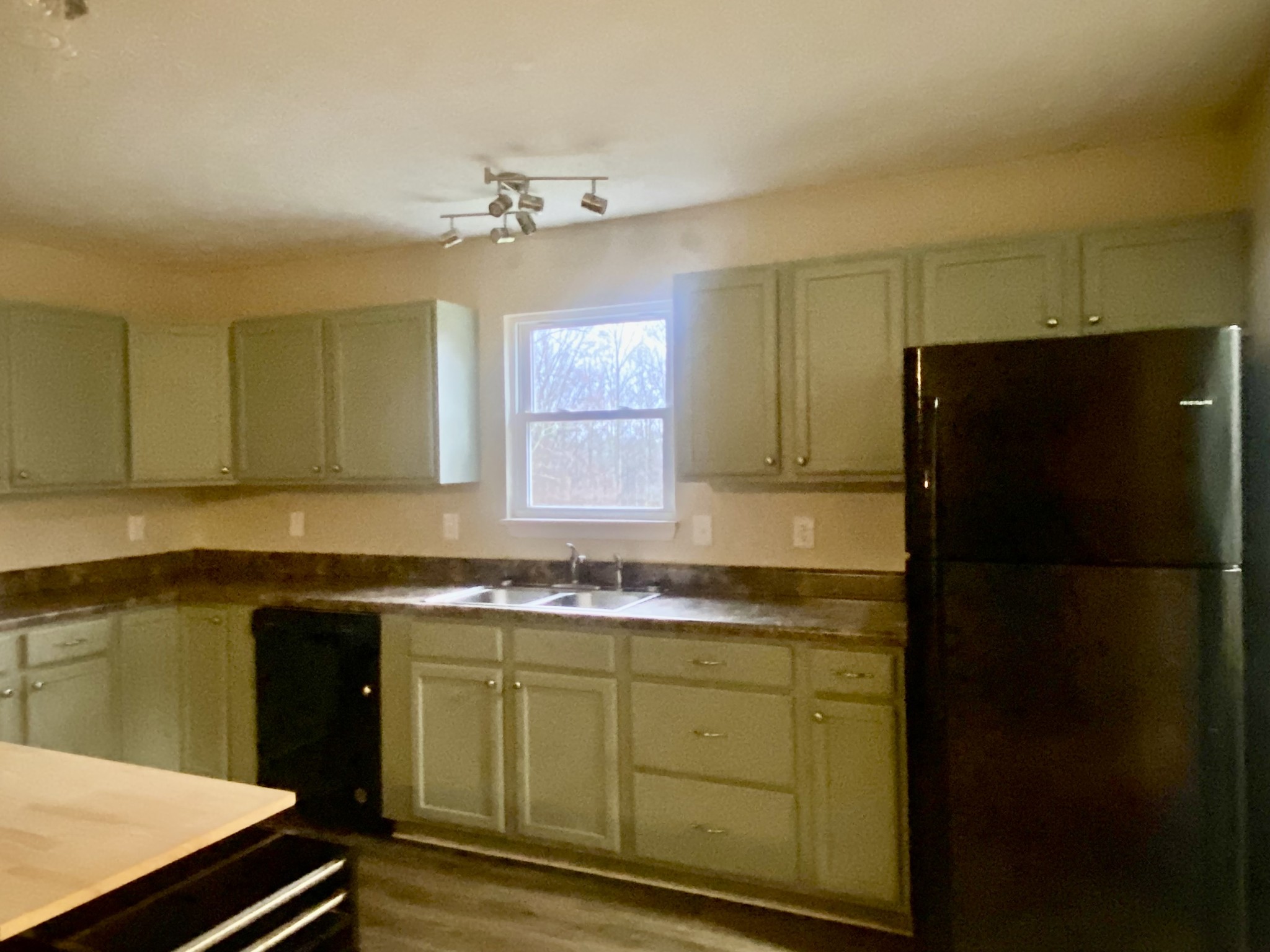 575 Simmons Cemetery Road Quebeck, TN 38579 - Photo 16 of 16 a kitchen with a sink and refrigerator