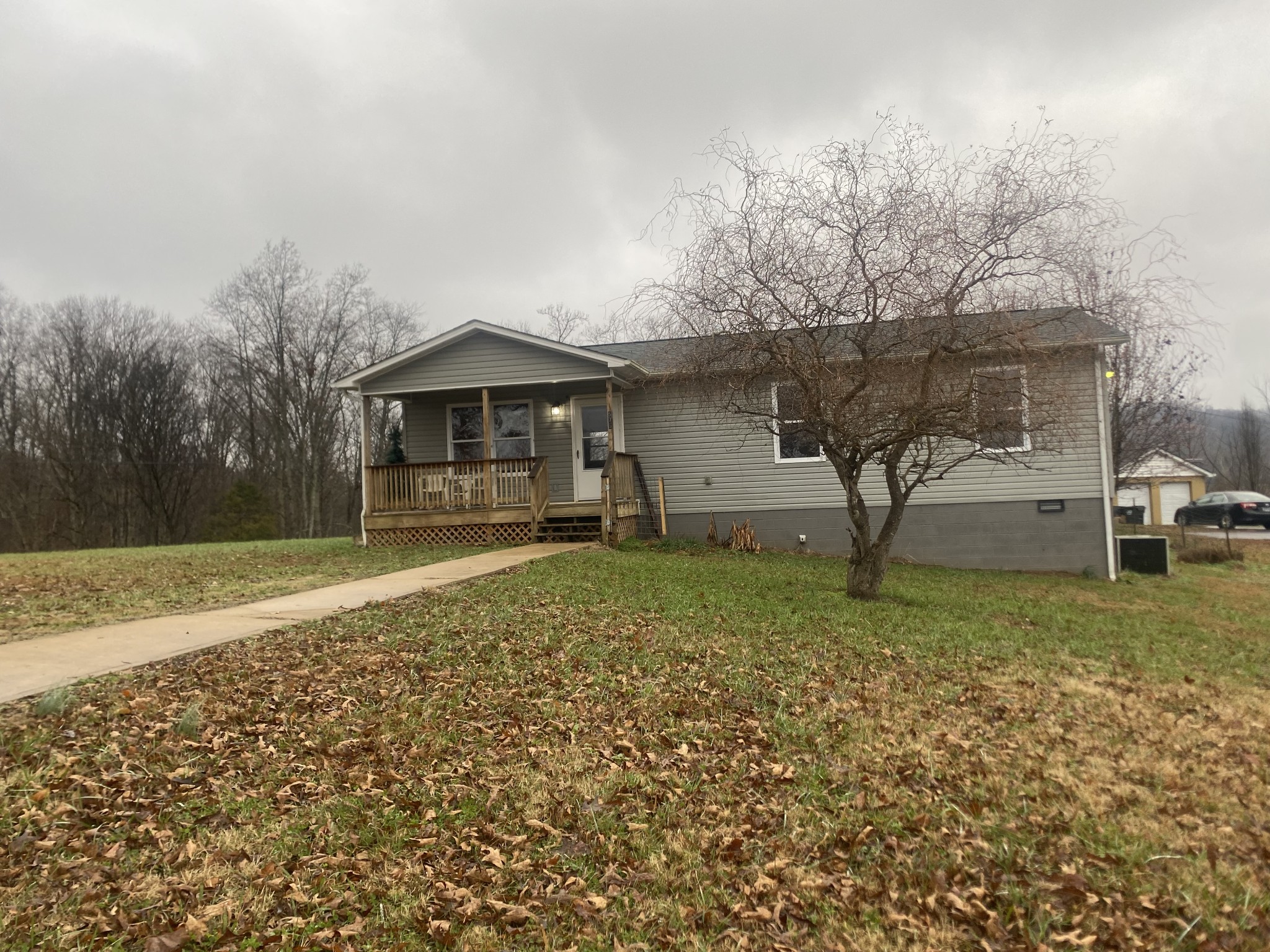 575 Simmons Cemetery Road Quebeck, TN 38579 - Photo 2 of 16 a backyard of a house with lots of green space