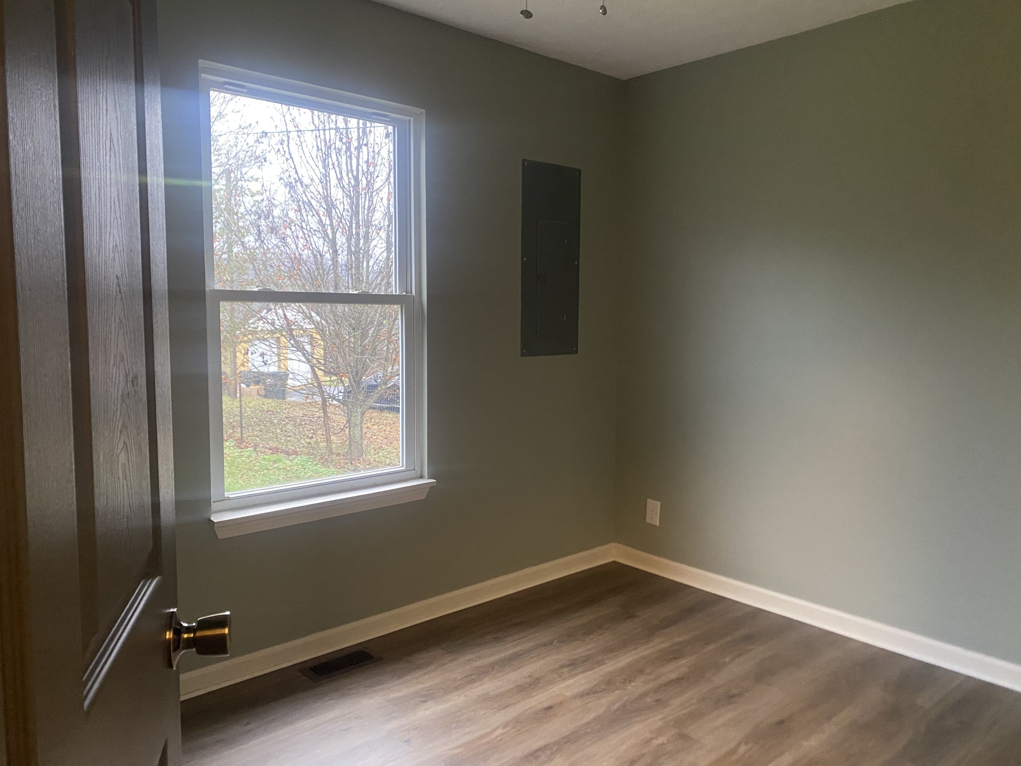 575 Simmons Cemetery Road Quebeck, TN 38579 - Photo 9 of 16 an empty room with wooden floor and windows