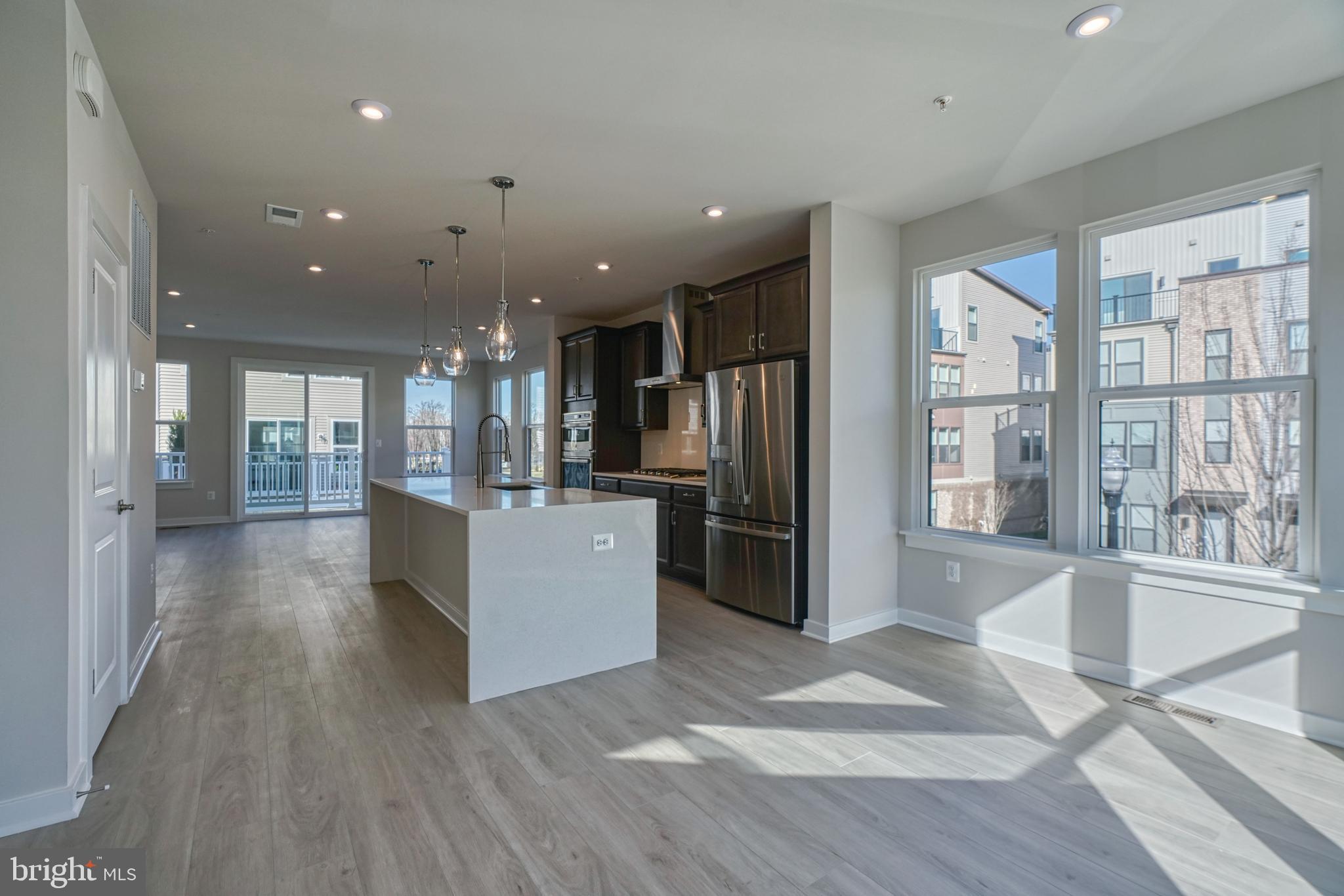 5612 Alpha Ridge Avenue Hyattsville, MD 20782 - Photo 23 of 70 a view of a kitchen with refrigerator and wooden floor