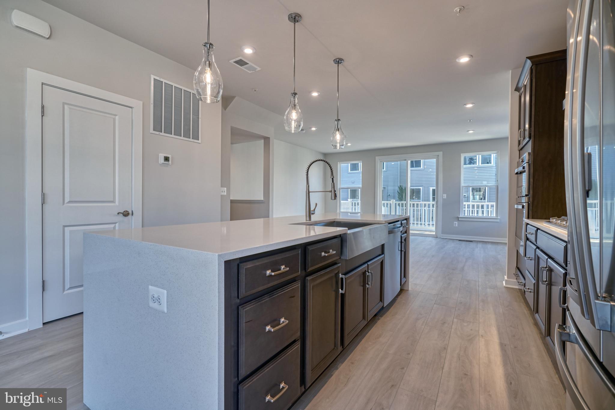5612 Alpha Ridge Avenue Hyattsville, MD 20782 - Photo 28 of 70 a kitchen with stainless steel appliances granite countertop a stove and a sink