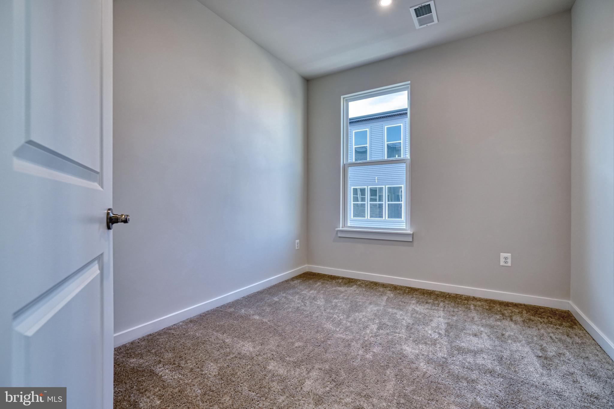 5612 Alpha Ridge Avenue Hyattsville, MD 20782 - Photo 36 of 70 a view of an empty room with a window