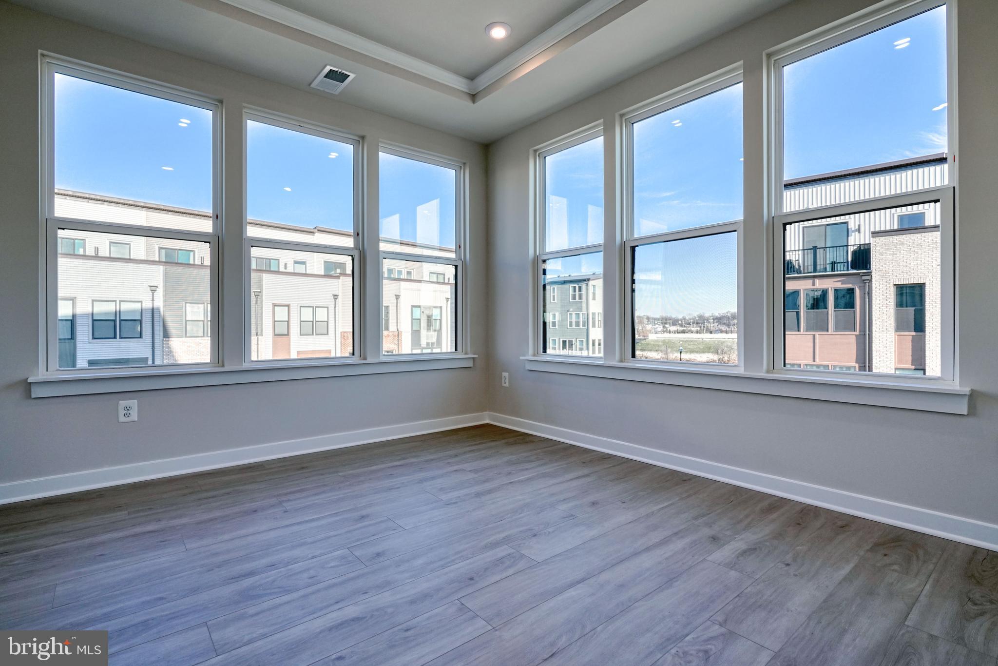 5612 Alpha Ridge Avenue Hyattsville, MD 20782 - Photo 40 of 70 a view of an empty room with wooden floor and a window