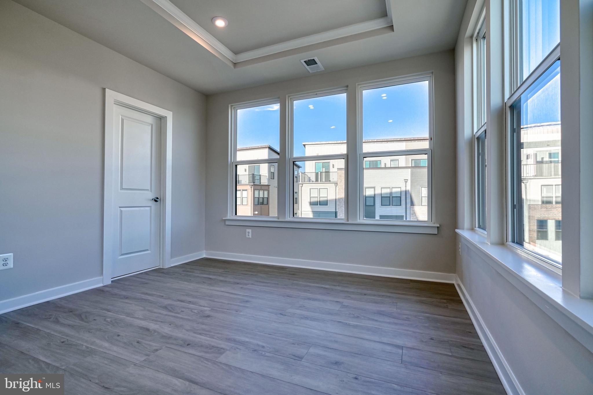 5612 Alpha Ridge Avenue Hyattsville, MD 20782 - Photo 41 of 70 a view of an empty room with wooden floor and a window