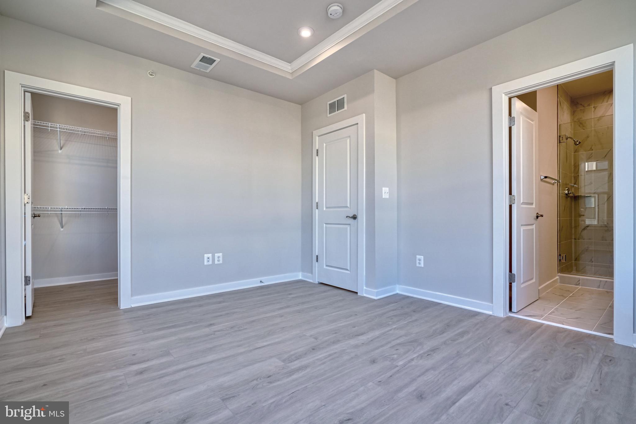 5612 Alpha Ridge Avenue Hyattsville, MD 20782 - Photo 42 of 70 a view of an empty room with wooden floor and a window