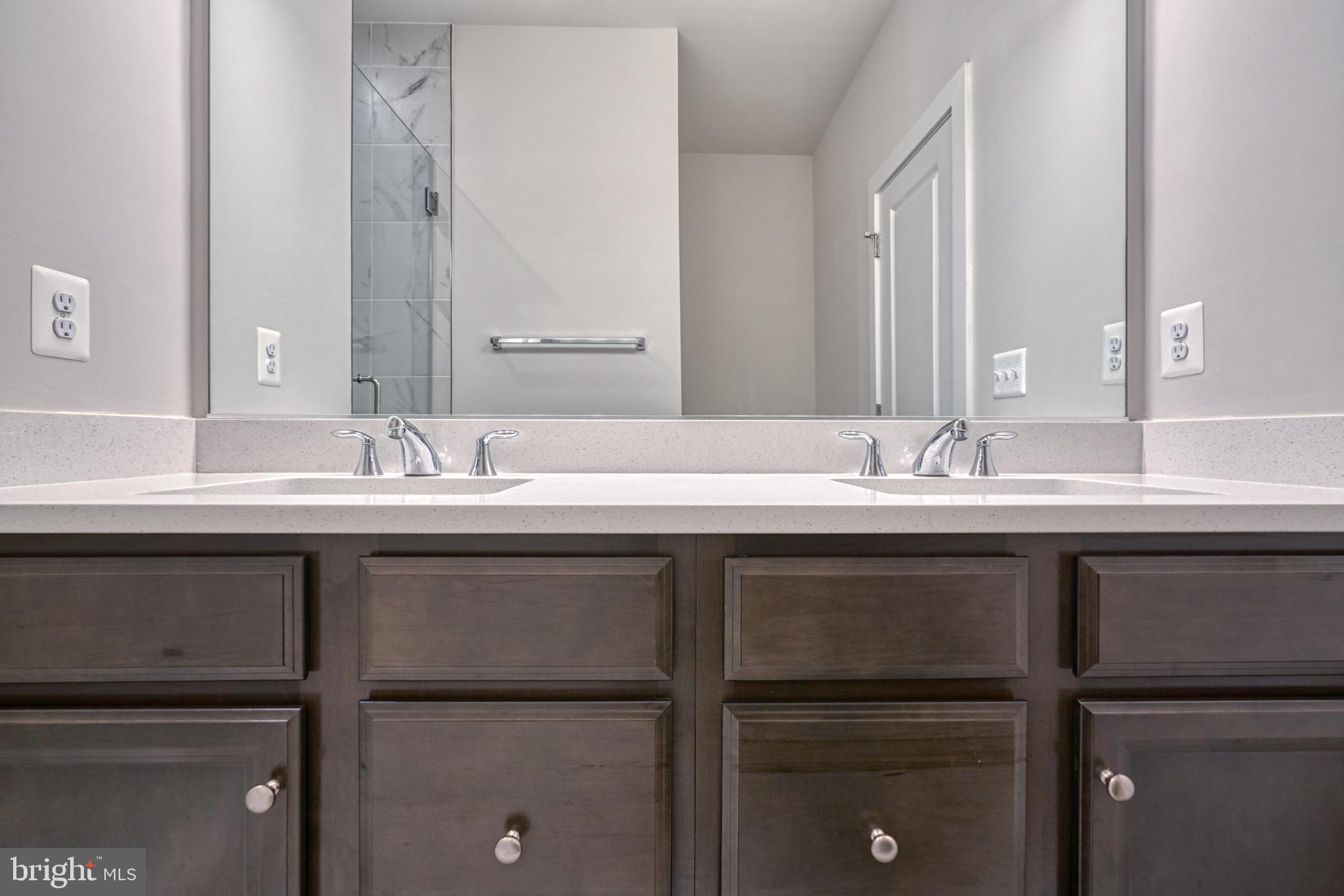 5612 Alpha Ridge Avenue Hyattsville, MD 20782 - Photo 45 of 70 a bathroom with a sink and a mirror