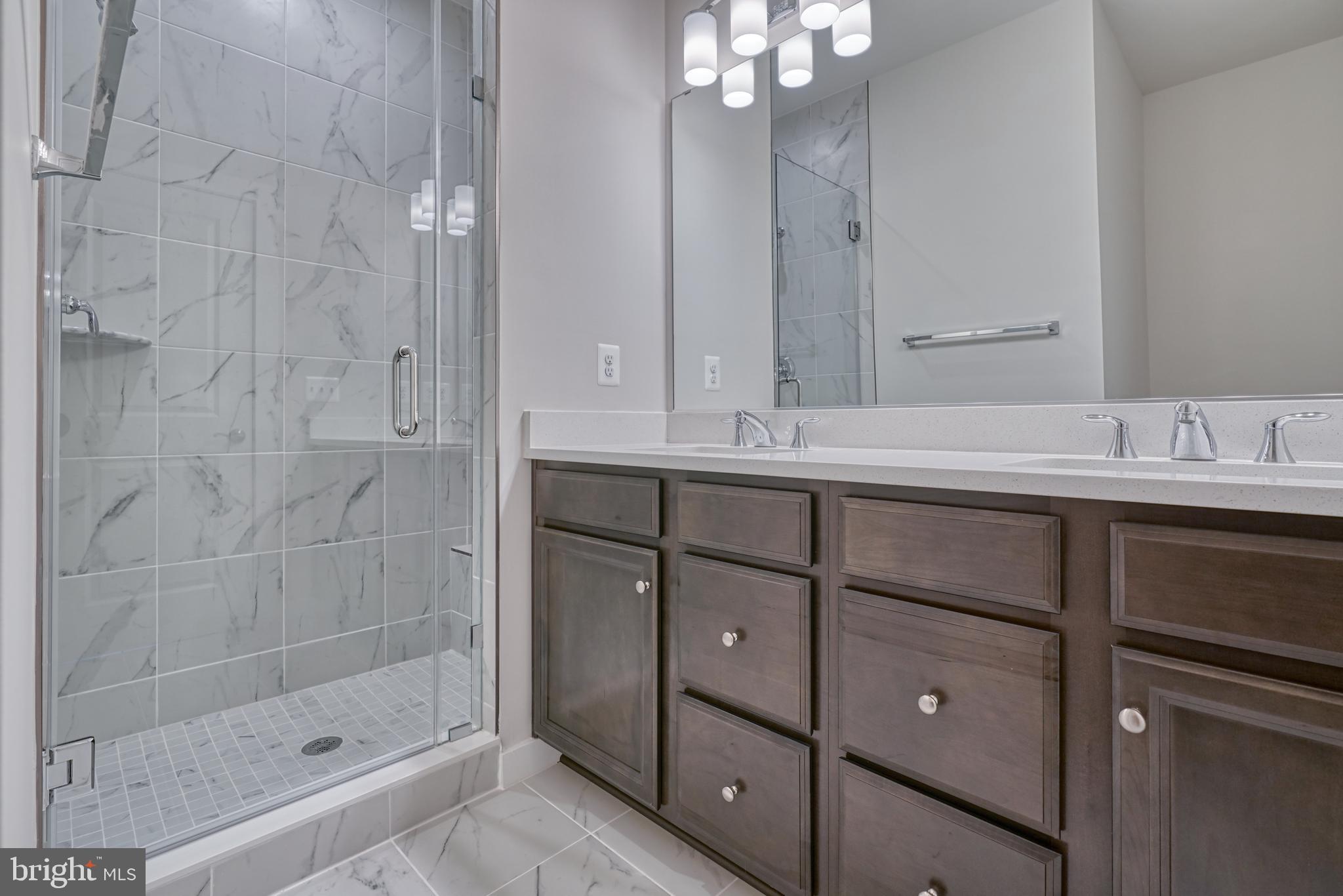 5612 Alpha Ridge Avenue Hyattsville, MD 20782 - Photo 46 of 70 a bathroom with a sink shower and a mirror