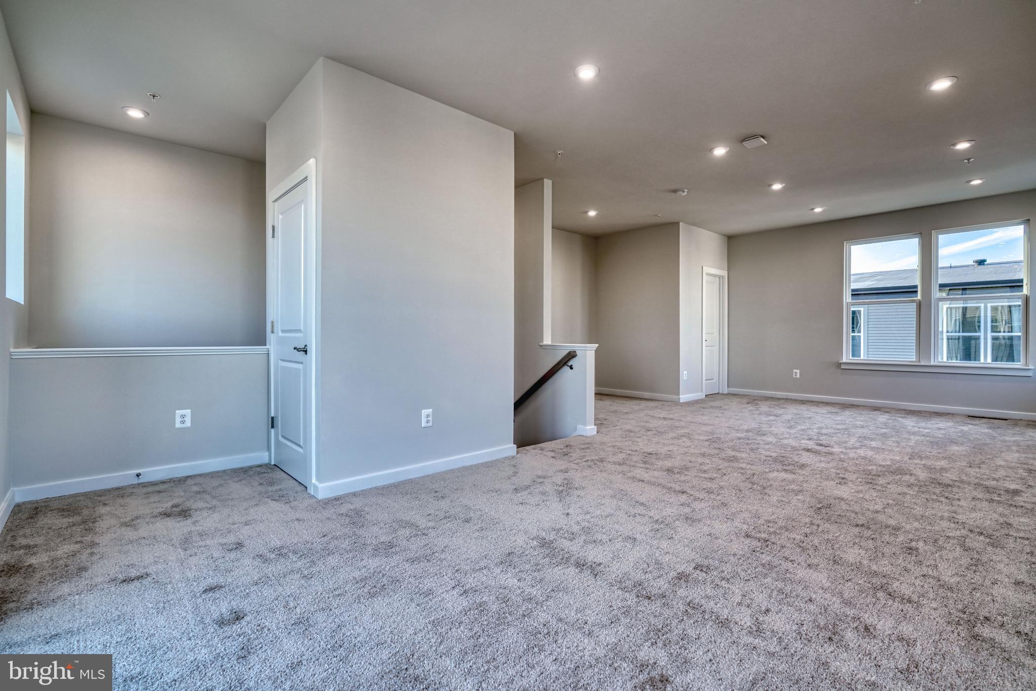 5612 Alpha Ridge Avenue Hyattsville, MD 20782 - Photo 49 of 70 an empty room with windows and pillars in it