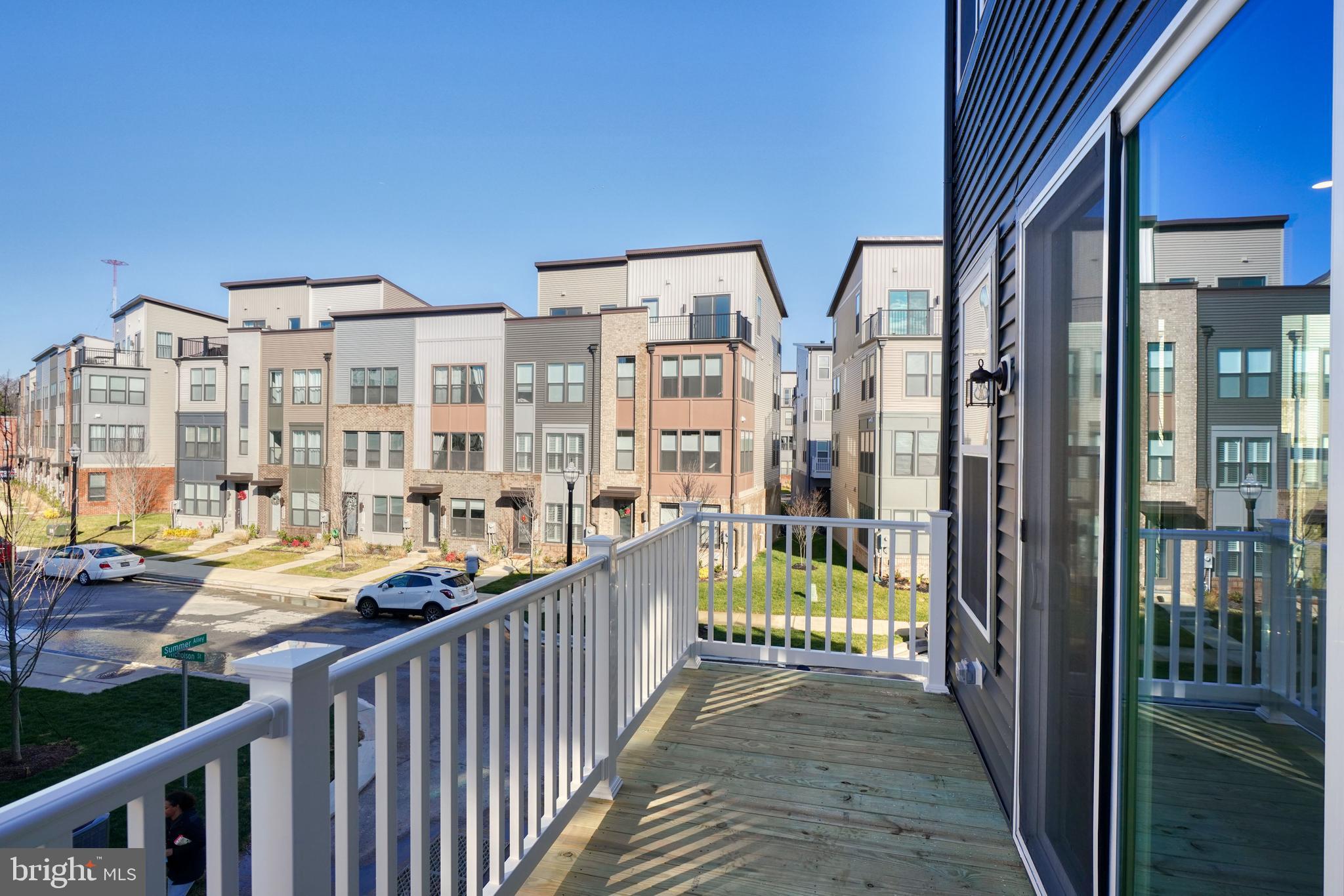 5612 Alpha Ridge Avenue Hyattsville, MD 20782 - Photo 67 of 70 a view of a balcony with wooden floor and fence