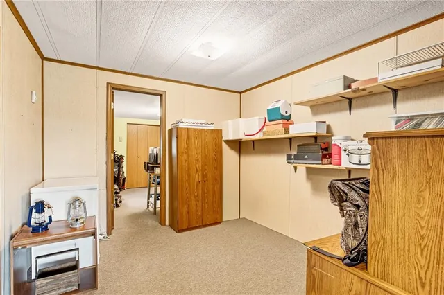 a dining room with furniture and a window