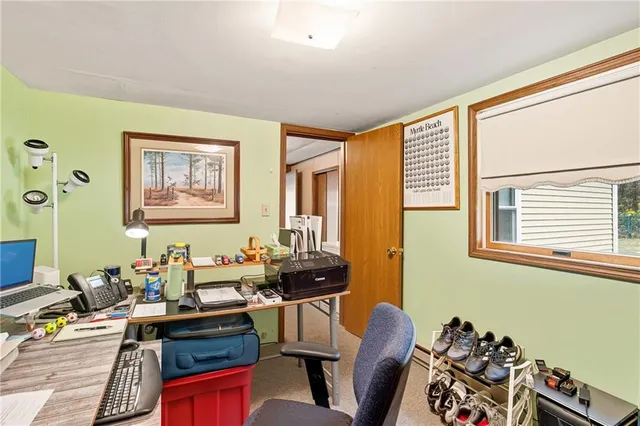 a view of a house with wooden deck