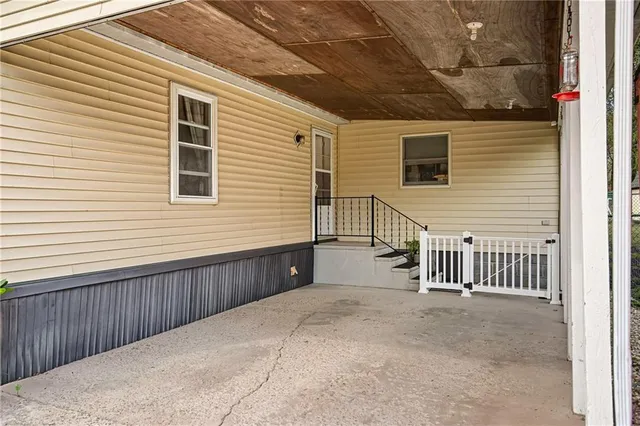 a view of a garden with a table and chairs