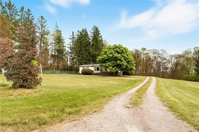 a view of a yard with a house