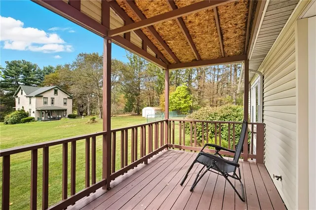 a view of balcony with wooden floor
