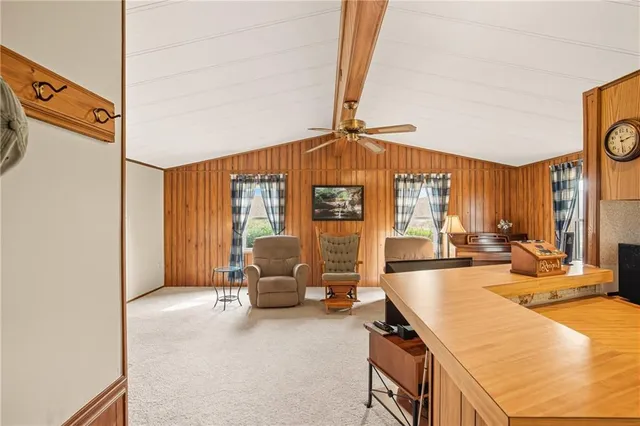 a view of a livingroom with furniture and window